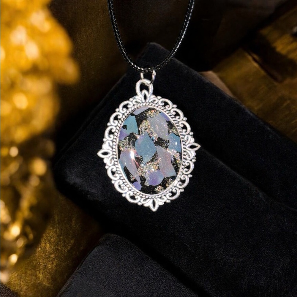 Ornate Silver and Black Necklace with Intricate Pendant